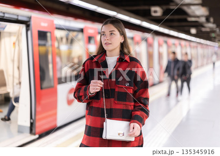 Woman changing to the subway Woman changing to the subway 135345916