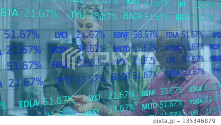 Two analysts in office attire discussing stock percentages in workspace, with digital glass board 135346879