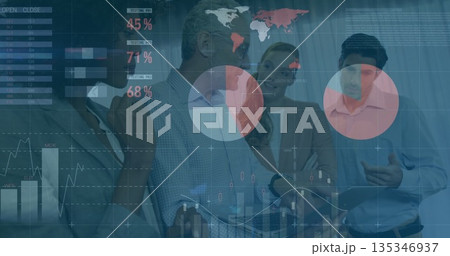 Analyzing team wearing suits examining financial data overlays on tablet in meeting room 135346937