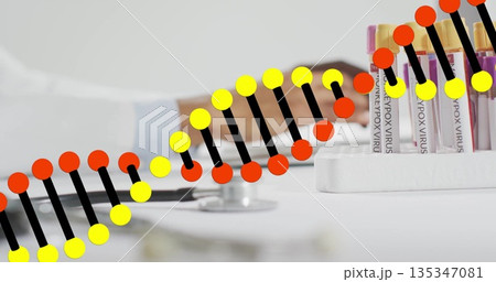 Reaching forearm toward keys on lab table with monkeypox test tubes, helix overlay, copy space Reaching forearm toward keys on lab table with monkeypox test tubes, helix overlay, copy space 135347081