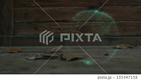 Floating holographic green data swirl hovering above wooden deck, with dried leaves and plank fence 135347158