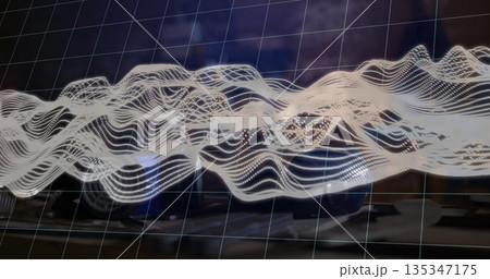 Displaying semi-transparent grid and white dotted waveform hovering over office desk, with keyboard Displaying semi-transparent grid and white dotted waveform hovering over office desk, with keyboard 135347175