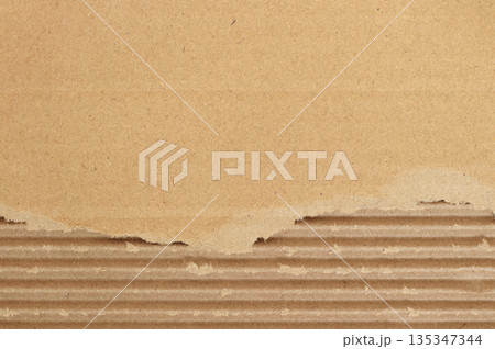 Brown cardboard sheet abstract background, texture of recycle paper box in old vintage pattern with ripped edges. Brown cardboard sheet abstract background, texture of recycle paper box in old vintage pattern with ripped edges. 135347344