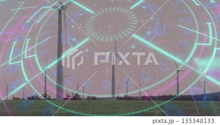 Spinning center white wind turbine standing over grassy field, with digital holographic overlay Spinning center white wind turbine standing over grassy field, with digital holographic overlay 135348133