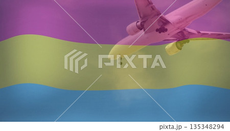Descending airplane with gear down under magenta yellow cyan stripes at airport, copy space Descending airplane with gear down under magenta yellow cyan stripes at airport, copy space 135348294