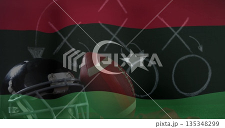 Displaying American football helmet and ball on chalkboard play diagram, with Libyan flag overlay 135348299