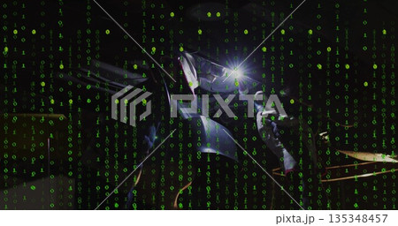 Leaning female welder welding workpiece at workshop, with torch, helmet, gloves and binary overlay Leaning female welder welding workpiece at workshop, with torch, helmet, gloves and binary overlay 135348457