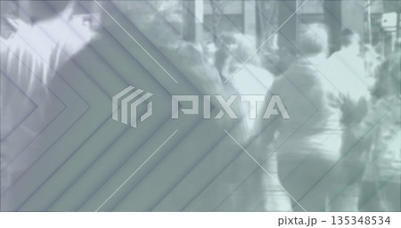 Walking pedestrians wearing casual streetwear moving along city sidewalk with chevron overlay 135348534