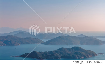Serene Coastal Mountain Range Over Port Shelter Serene Coastal Mountain Range Over Port Shelter 135348872