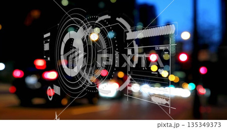 Overlaying semi-transparent digital HUD on urban street at night, showing blurred car lights 135349373