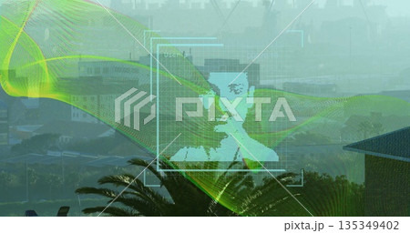 Displaying pixelated green face with grid and waveform overlay on misty hillside with palm trees 135349402