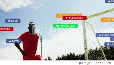 Kicking soccer player wearing red kit near white goal net, with social media icons, copy space Kicking soccer player wearing red kit near white goal net, with social media icons, copy space 135350026