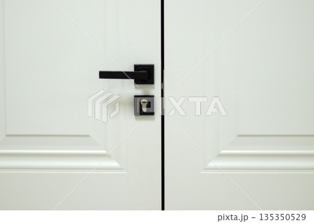 closed door of a white room 135350529