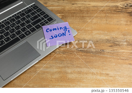 Note on laptop indicates upcoming project or event announcement Note on laptop indicates upcoming project or event announcement 135350546