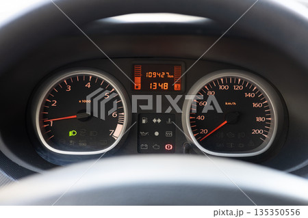 Car dashboard with speedometer and mileage display at 1348 Car dashboard with speedometer and mileage display at 1348 135350556