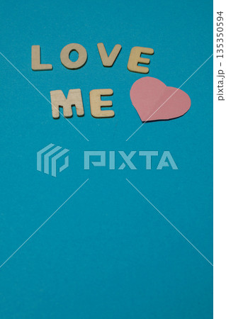 Letters and a heart on a blue background show a message of affection Letters and a heart on a blue background show a message of affection 135350594