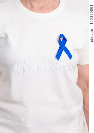 Elderly with dark Blue or Navy blue Ribbon for concept of March Colorectal and Colon Cancer Awareness month, May Arthritis awareness, July Juvenile arthritis and Childhood. Health and world cancer day 135350891