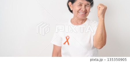 Elderly with Orange Ribbon for September Leukemia, March Kidney cancer day, Multiple Sclerosis, Self Injury Awareness month, November Complex Regional Pain Syndrome, CRPS, COPD disease concept 135350905