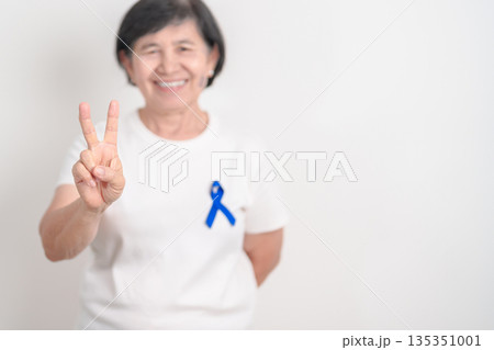 Elderly with dark Blue or Navy blue Ribbon for concept of March Colorectal and Colon Cancer Awareness month, May Arthritis awareness, July Juvenile arthritis and Childhood. Health and world cancer day Elderly with dark Blue or Navy blue Ribbon for concept of March Colorectal and Colon Cancer Awareness month, May Arthritis awareness, July Juvenile arthritis and Childhood. Health and world cancer day 135351001