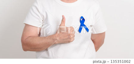 Elderly with dark Blue or Navy blue Ribbon for concept of March Colorectal and Colon Cancer Awareness month, May Arthritis awareness, July Juvenile arthritis and Childhood. Health and world cancer day Elderly with dark Blue or Navy blue Ribbon for concept of March Colorectal and Colon Cancer Awareness month, May Arthritis awareness, July Juvenile arthritis and Childhood. Health and world cancer day 135351002