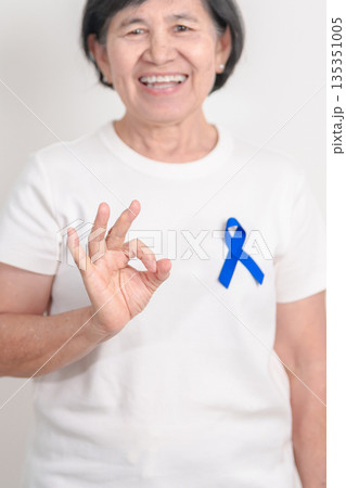 Elderly with dark Blue or Navy blue Ribbon for concept of March Colorectal and Colon Cancer Awareness month, May Arthritis awareness, July Juvenile arthritis and Childhood. Health and world cancer day Elderly with dark Blue or Navy blue Ribbon for concept of March Colorectal and Colon Cancer Awareness month, May Arthritis awareness, July Juvenile arthritis and Childhood. Health and world cancer day 135351005