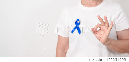 Elderly with dark Blue or Navy blue Ribbon for concept of March Colorectal and Colon Cancer Awareness month, May Arthritis awareness, July Juvenile arthritis and Childhood. Health and world cancer day 135351006