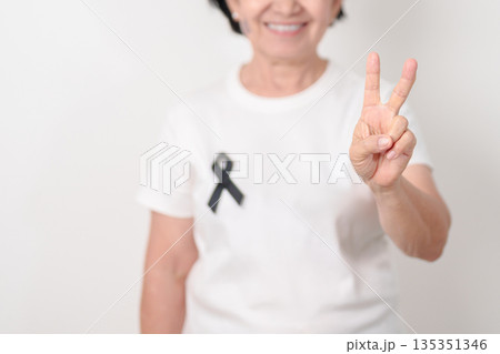 Elderly with Black ribbon for May Melanoma and skin cancer Awareness month, October Vaccine injury awareness month, Mourning Remembrance, March Sleep awareness week, Gang Prevention and Anti Violence Elderly with Black ribbon for May Melanoma and skin cancer Awareness month, October Vaccine injury awareness month, Mourning Remembrance, March Sleep awareness week, Gang Prevention and Anti Violence 135351346