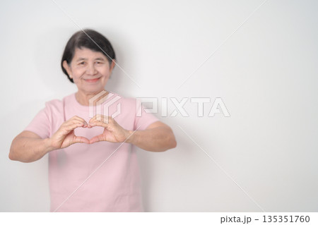 Elderly woman with pink Shirt for Pink October Breast Cancer Awareness month, May Women Health, women rights, Empowerment, March International Women day, February Valentine, May International Mother 135351760