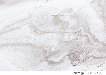 Snow mixed with sand, top view, frozen dune wavy pattern. Baltic Sea coast Snow mixed with sand, top view, frozen dune wavy pattern. Baltic Sea coast 135352388