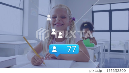 Writing girl with blonde pigtails working with yellow pencil at classroom desk, with notifications Writing girl with blonde pigtails working with yellow pencil at classroom desk, with notifications 135352800