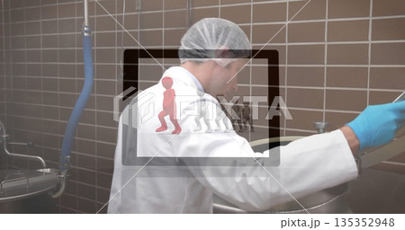 Sampling mixture in steel vat, gloved technician wearing lab coat in facility, with digital overlay Sampling mixture in steel vat, gloved technician wearing lab coat in facility, with digital overlay 135352948