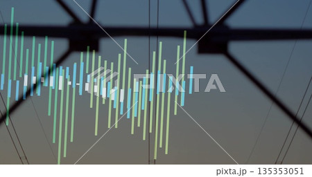 Highlighting tower crossarm silhouette merging in utility corridor at dusk, with faint data bars 135353051