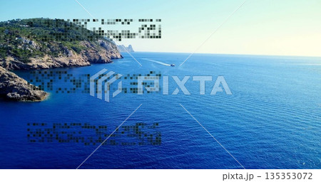 Gliding small white speedboat leaving wake across sea past rocky cliffs with shrubs, copy space 135353072