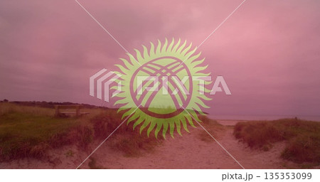 Sandy pathway winding through grassy dunes toward shore with wooden bench and stylized sun emblem Sandy pathway winding through grassy dunes toward shore with wooden bench and stylized sun emblem 135353099