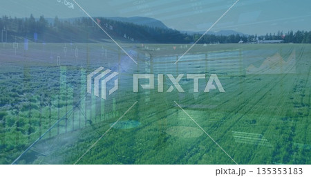 Extending center pivot irrigation arm sprinkling green crop rows at farm field, with farm building Extending center pivot irrigation arm sprinkling green crop rows at farm field, with farm building 135353183