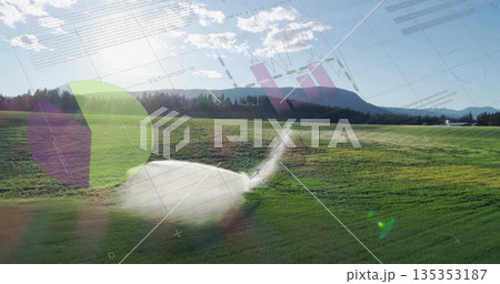 Spraying metal sprinkler head sending water arc across grassy field, with pie chart graph overlays Spraying metal sprinkler head sending water arc across grassy field, with pie chart graph overlays 135353187