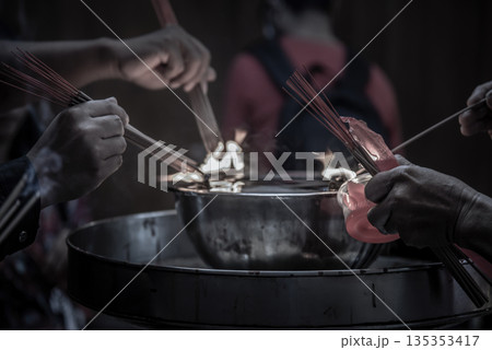 Incense burning at a temple in Wat Mangkon Kamalawat, Bangkok. 135353417