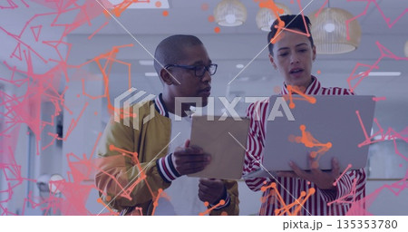 Collaborating colleagues sharing tablet laptop in office, with network overlay and woven pendants Collaborating colleagues sharing tablet laptop in office, with network overlay and woven pendants 135353780