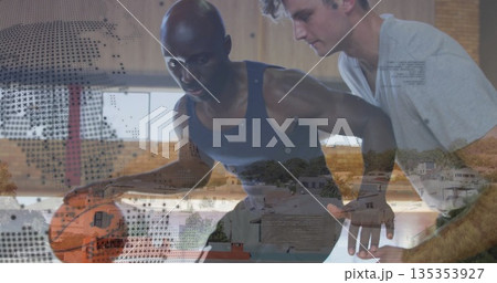 Dribbling athlete in sportswear facing defender on court in gym, with basketball and lines 135353927