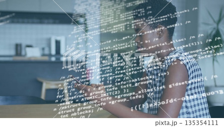 Woman in checked blouse using smartphone viewing code at kitchen table with coffeemaker, copy space 135354111