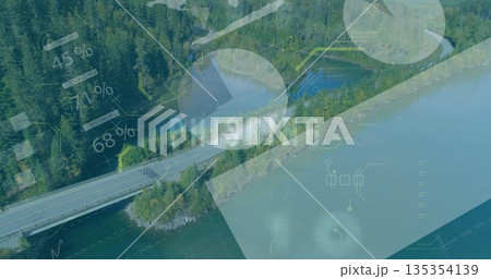 Displaying narrow paved causeway cutting across reservoir in conifer forest, with phishing overlays 135354139