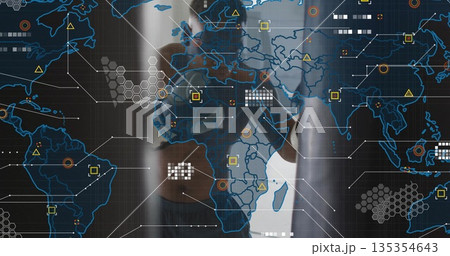 Operating touchscreen Black male wearing smartwatch in office, with map and colored data nodes 135354643
