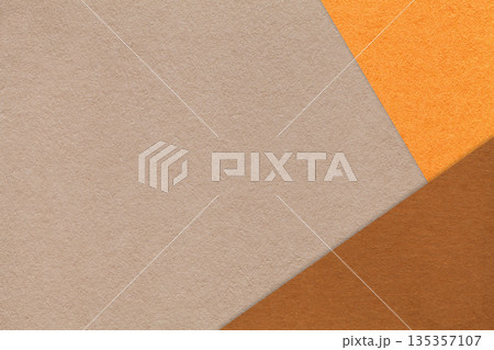 Abstract warm beige, orange and brown paper background with copy space. Template for presentation, banner, card design 135357107