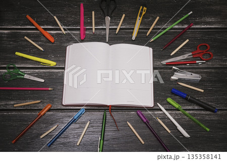 Stationery and notebook - colorful pencils and stuff equipment on wooden background 135358141