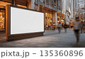 Blank boulevard billboard with warm soft light and blurred motion in a modern cityscape 135360896
