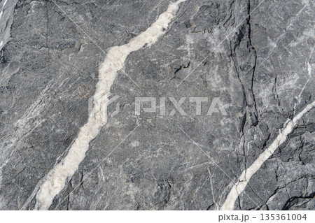 Natural stone surface with white mineral veins texture Natural stone surface with white mineral veins texture 135361004