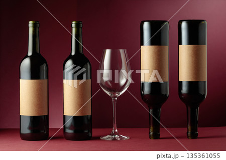 Red wine on a dark red background. 135361055