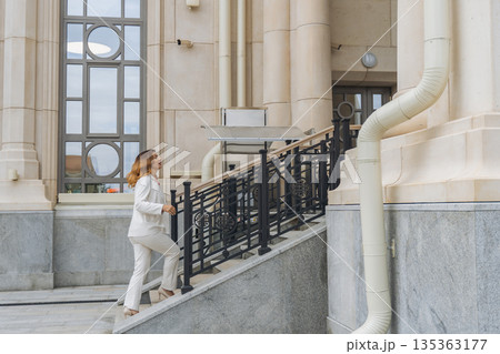 Woman White Suit Stairs Building Woman White Suit Stairs Building 135363177