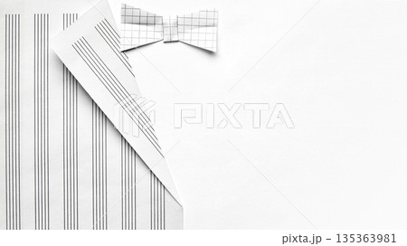 Paper shirt with bow tie folded from grid paper flat lay. 135363981
