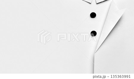 Paper shirt detail with black buttons minimalist flat lay. Paper shirt detail with black buttons minimalist flat lay. 135363991